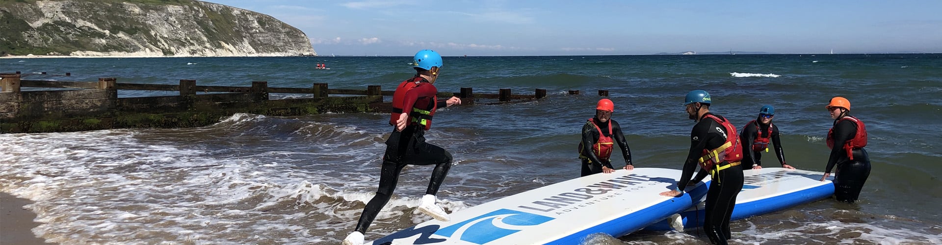 Group of people surfboard training